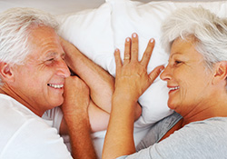 Couple's Smiling in Bed