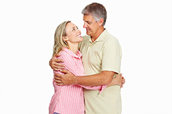 Couple Eye Gazing Middle Age Hug